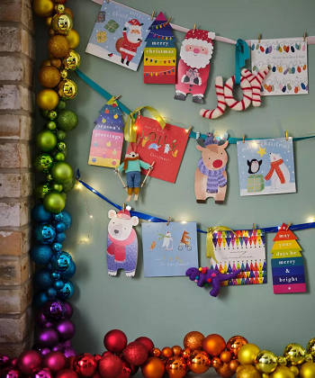 Hang the card in rainbow-bright ribbon How To Have Creative Christmas Card Display Ideas This Year