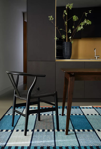 Large area rug No-Fail Design Tips To Make A Small Dining Room Look Bigger