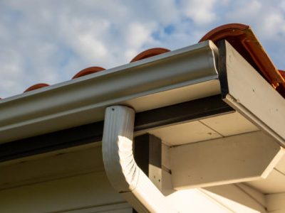 House with new seamless aluminum rain gutters downpipe