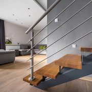 New design light open living room with balcony and wooden staircase