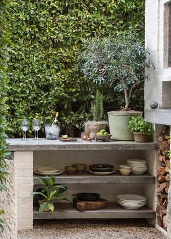 Plants to have the bar blend in How To Fit An Outdoor Bar into A Small Backyard For A Perfect Sundowner Spot