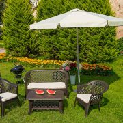 Garden with wooden dining table set