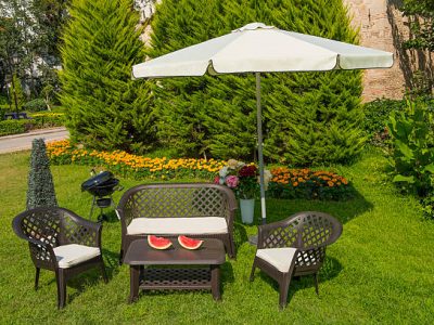 Garden with wooden dining table set