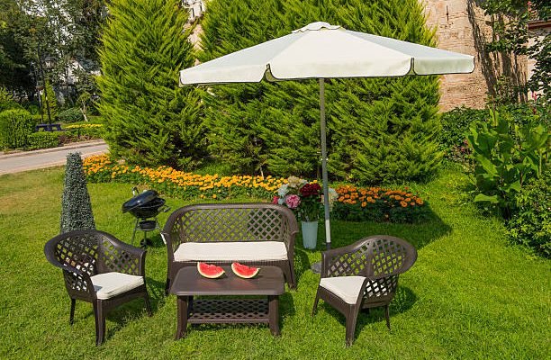 Garden with wooden dining table set
