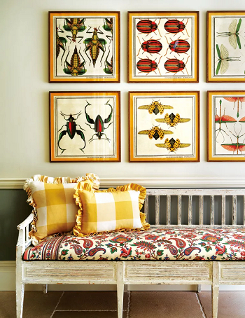 A symmetrical display Decorating Above A Sofa For Focal Point Transformation