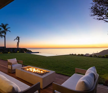 Cozy up the set up with a fireplace How To Create More Inviting Deck For Effortless Indoor Outdoor Look