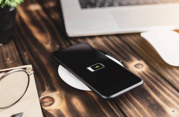 Close-up phone charging on wireless charger device