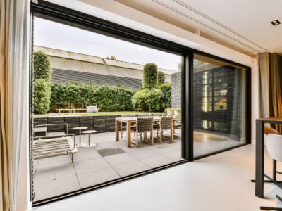 Attractive huge sliding glass door leading to the courtyard