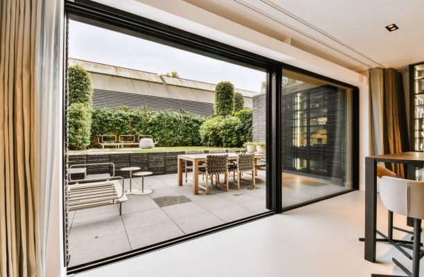 Attractive huge sliding glass door leading to the courtyard