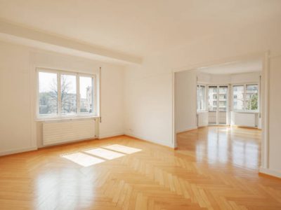 Interior of a modern empty apartment with big windows