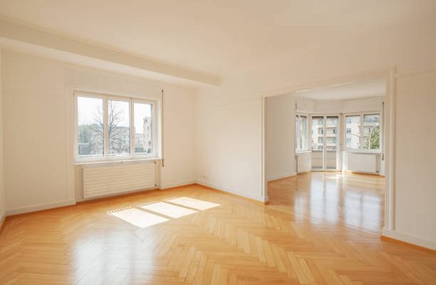 Interior of a modern empty apartment with big windows