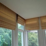 Brown blind shade curtain and shadow tree forest mountain background