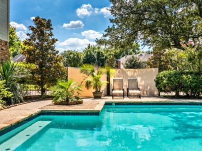 Backyard oasis with a swimming pool inside a private residential backyard
