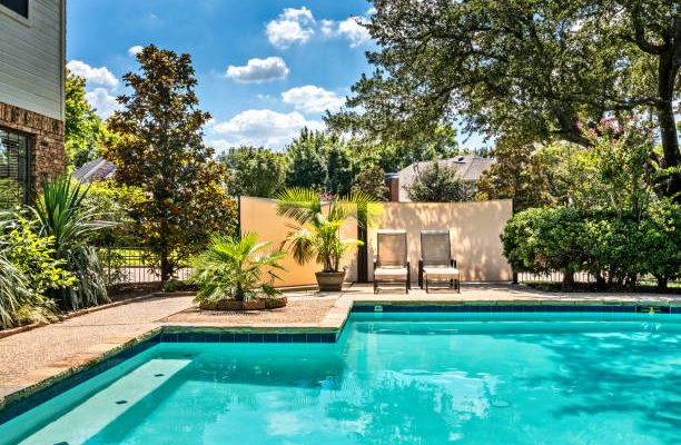 Backyard oasis with a swimming pool inside a private residential backyard