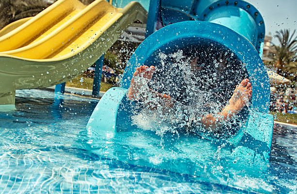 Little girl in water park. actually little feet in waterpark.