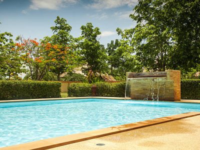 An empty swimming pool in a resort.