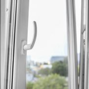 Metal-plastic windows are opened for ventilation