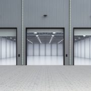 3d rendering interior empty factory with open shutter door
