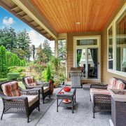 Cozy covered sitting area with wicker chairs and barbecue. northwest, usa