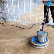 People polishes floor indoors