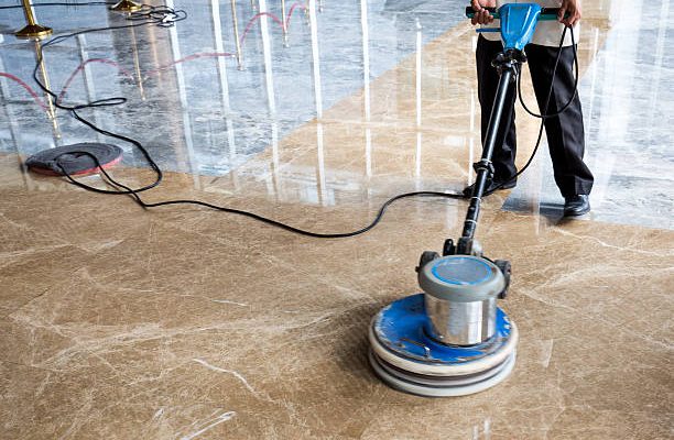 People polishes floor indoors