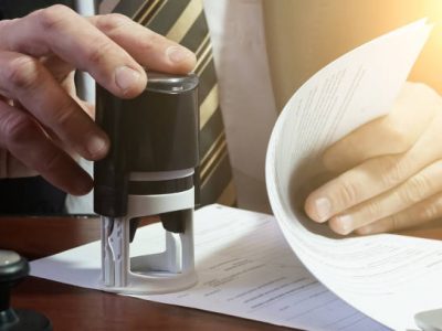 The businessman puts a stamp on the contract. copy space.