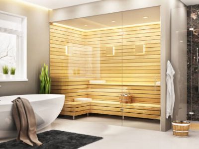 Beautiful bathroom with white bath and sauna and shower in a modern home