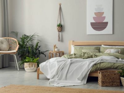 Stylish room interior with comfortable wooden bed