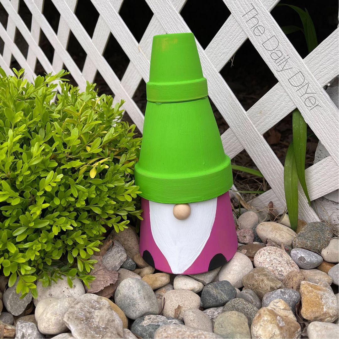 This gnome looks cute. You can make it by using terracotta pots. 