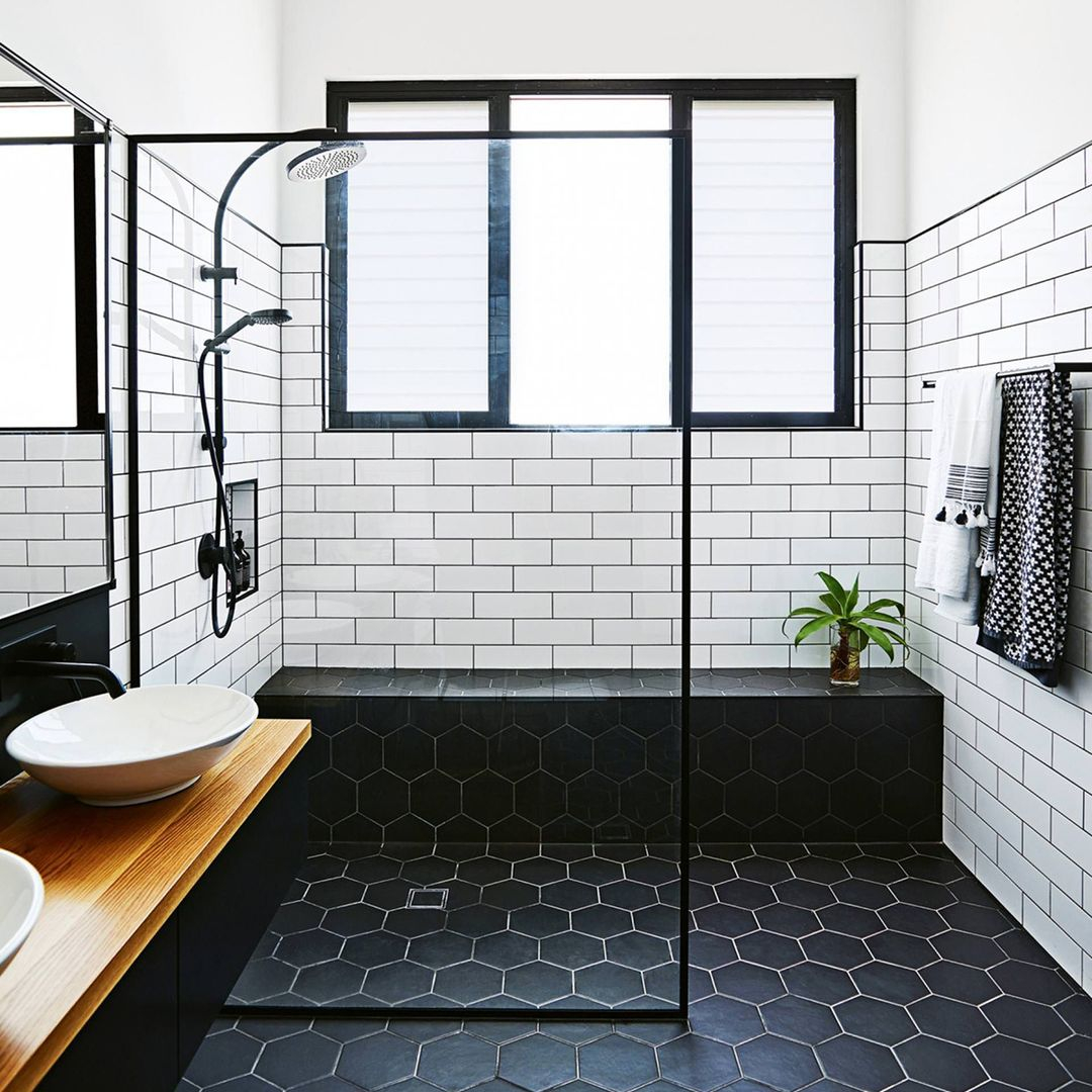 The flooring tile is in black with a hexagonal form. It is functional to bring the black dark atmosphere into the bathroom and create uniqueness.