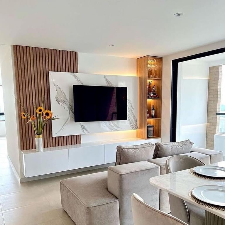 The wall is accented by using the wood slat. Then, you can also see there is a marble pallet used to be the background of the television.