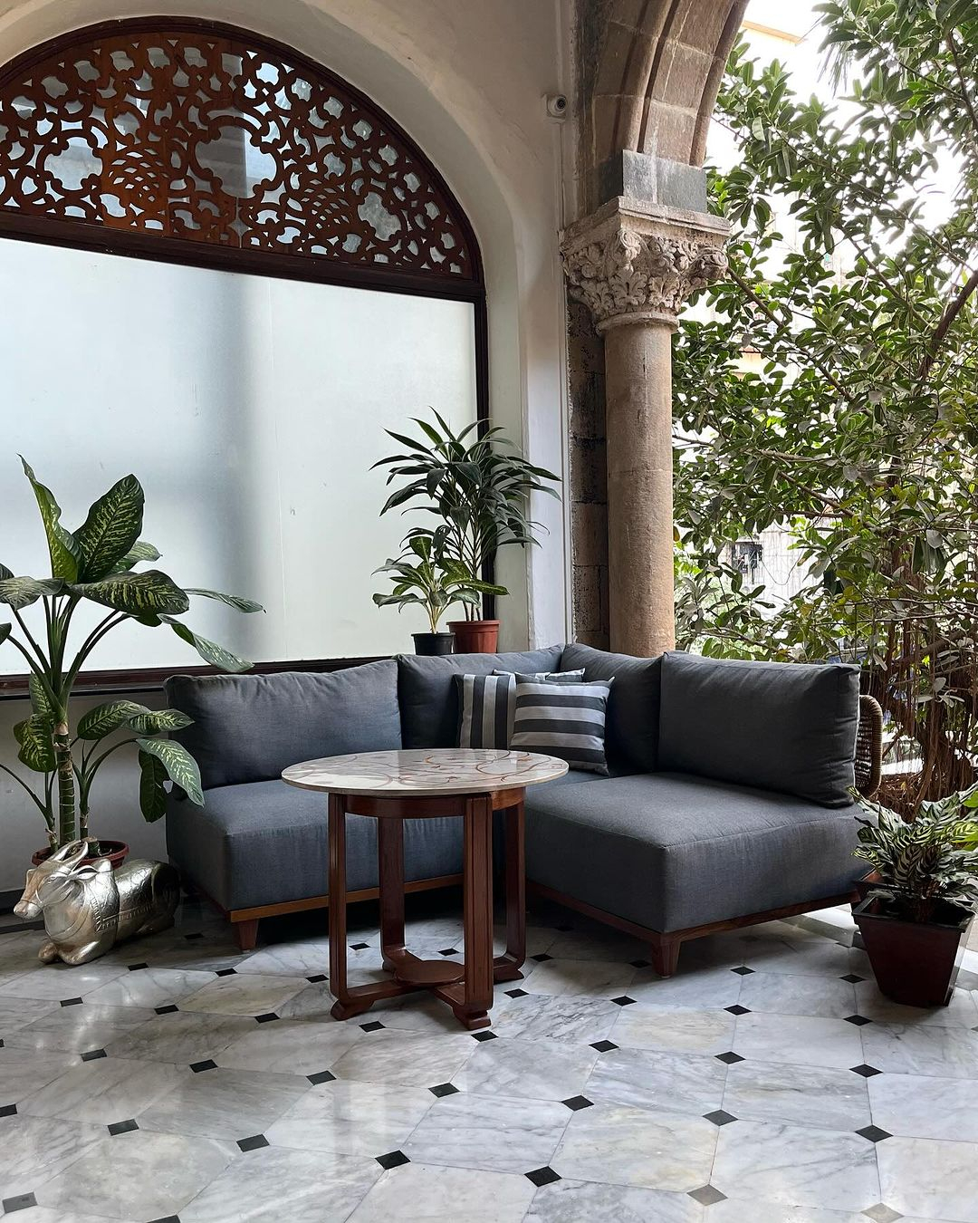 Small porch sofa in grey color.