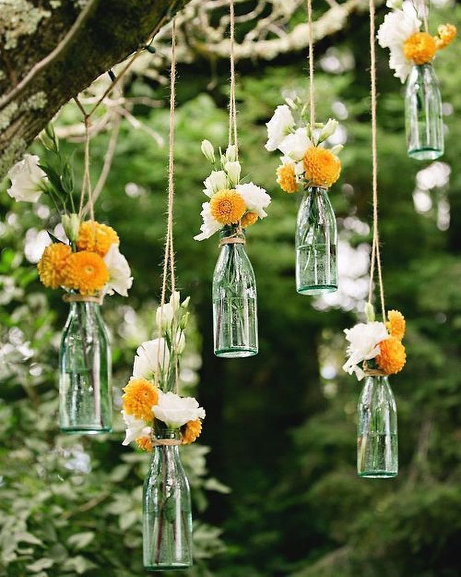 The clear glass bottle can be beautiful to be used as a hanging vase.