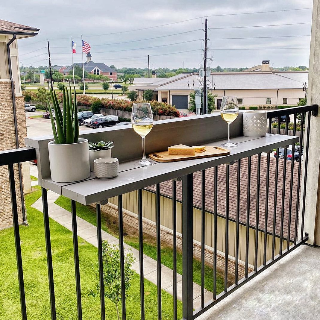 This bar table is designed to have a wall. It is functioned to minimize the risk of the stuff put there to fall. 