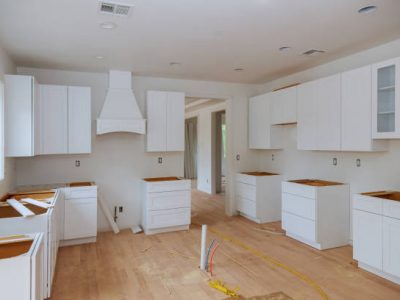 Preparing to install custom new kitchen cabinet in modern