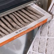 Replacing dirty furnace filter in home