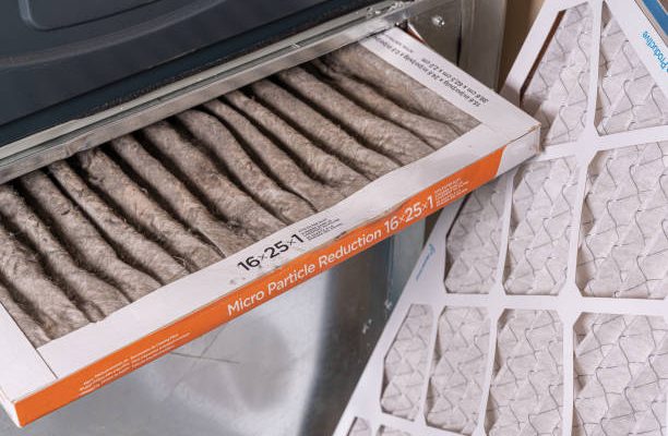 Replacing dirty furnace filter in home