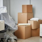Relocation to a new office with packed cardboard boxes and furniture