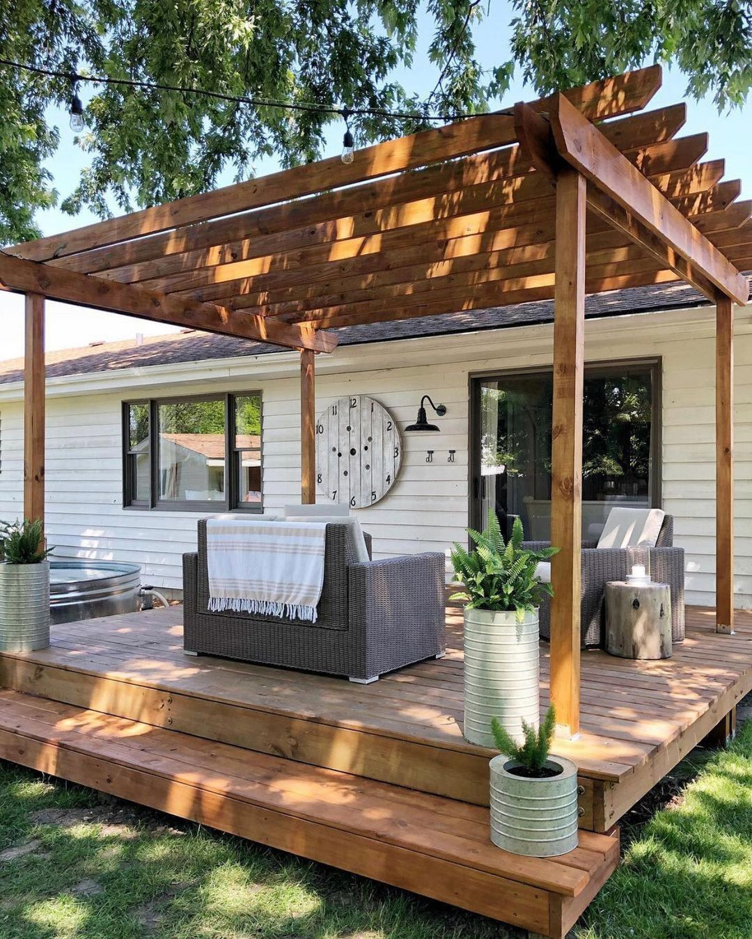Look at the artificial wall clock on the wall. The material is pallet wood that matches the deck.