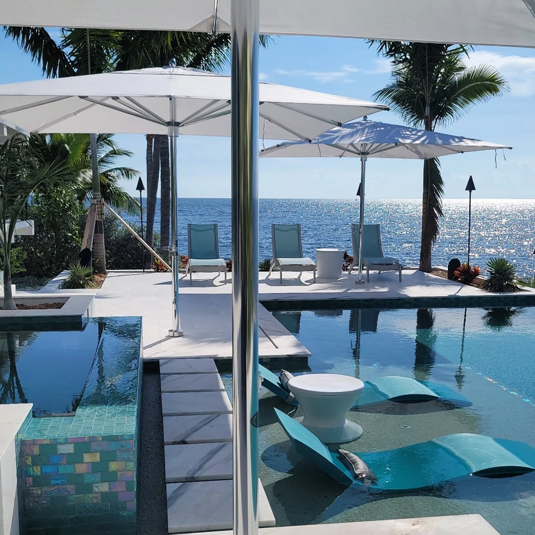 The umbrellas are not only installed on the lounge chairs area but also near the pool area to protect you in case you want to sit on the edge of the pool.