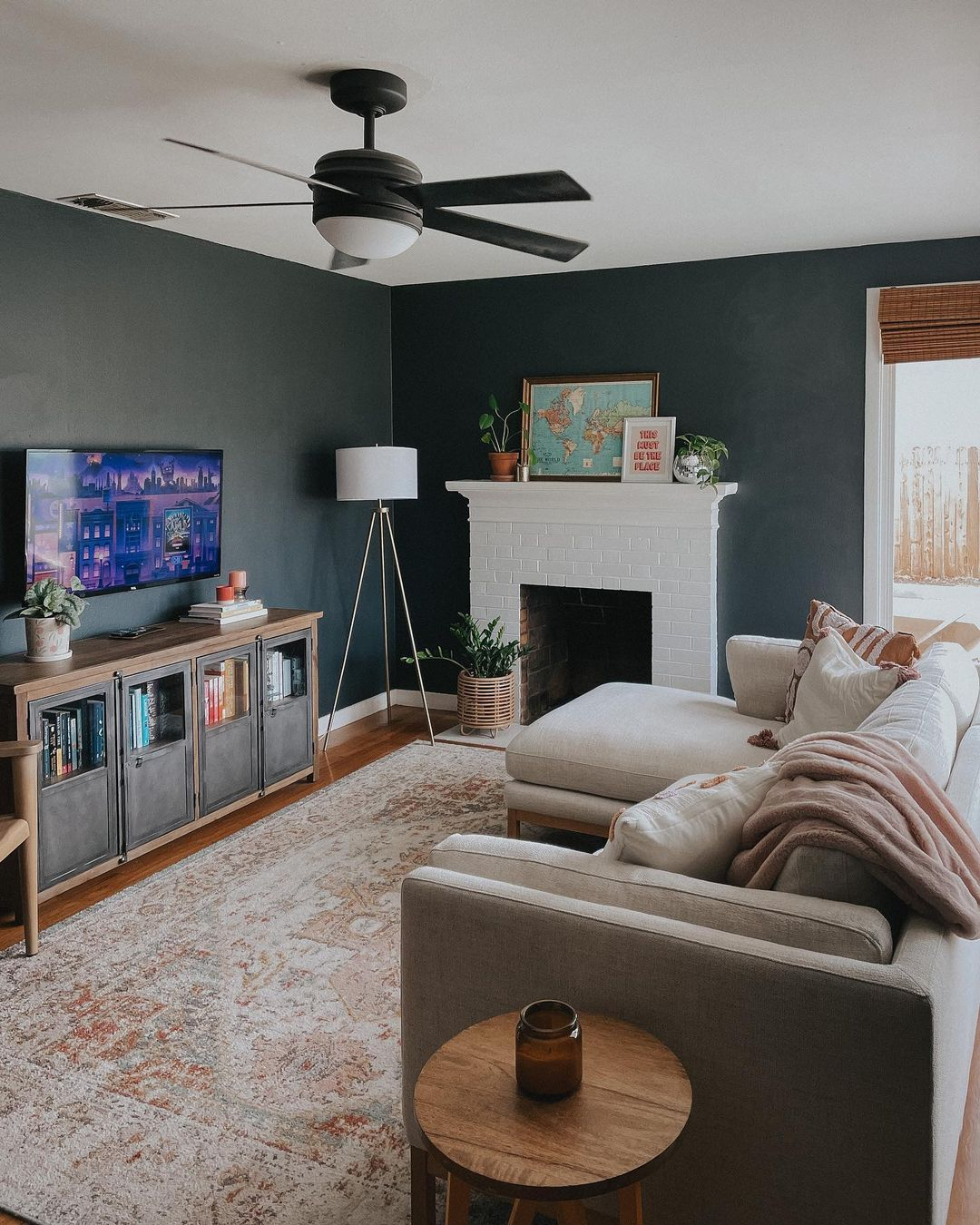 Adding indoor plants in the black and neutral living room