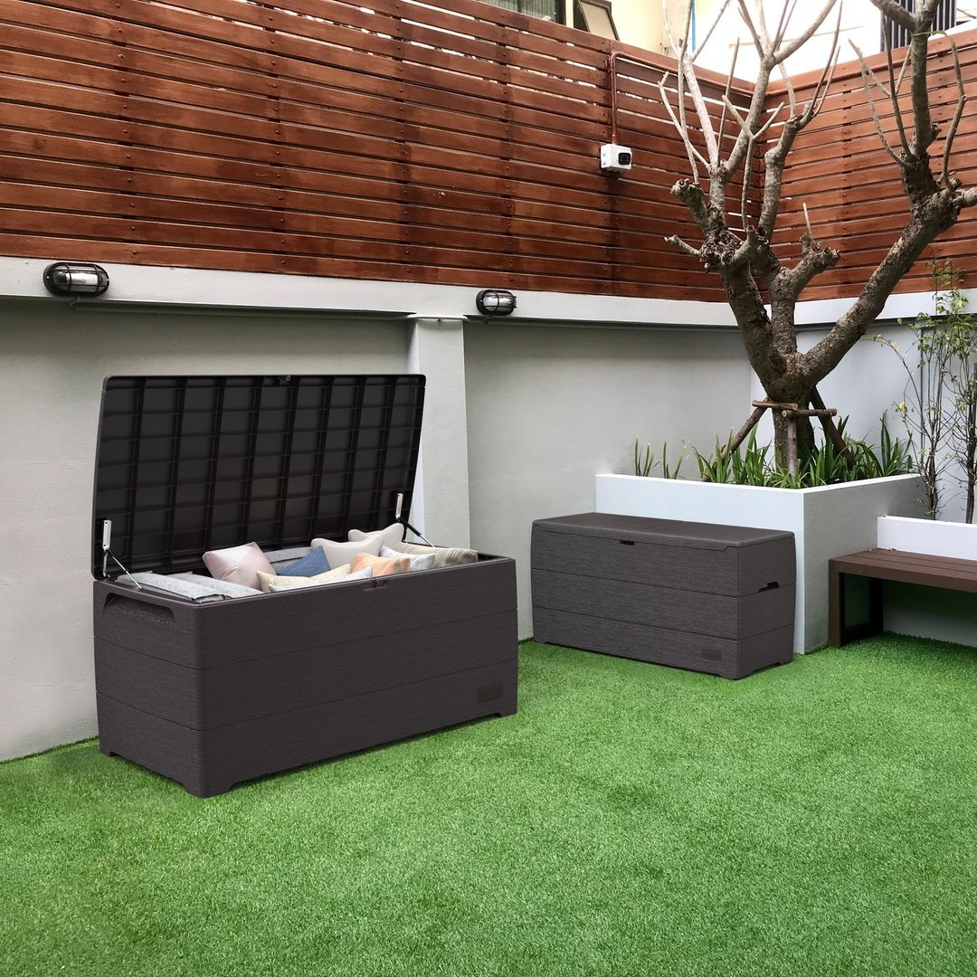 Tere are some cushions and throw blankets stored inside the storage. Then, when it is being closed, this storage is juggled into a bench.