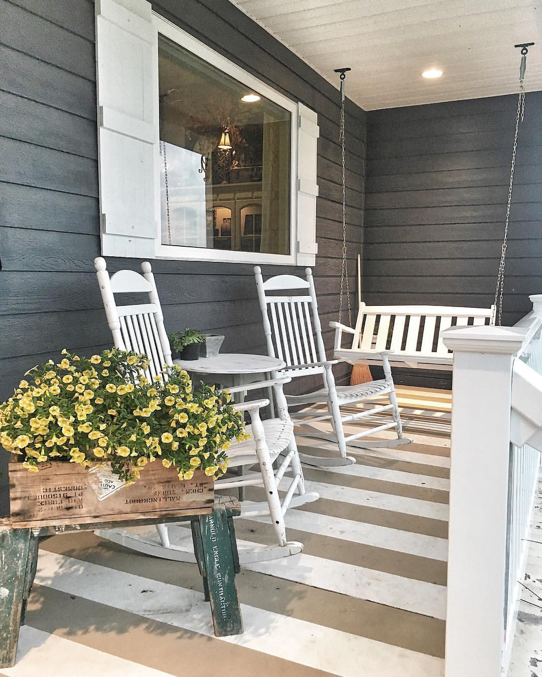 White rocking chairs and porch swing