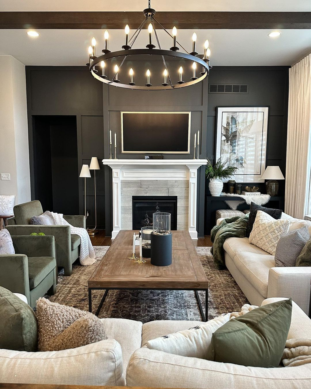 Green accent chairs to add a pop of color in a black and neutral living room