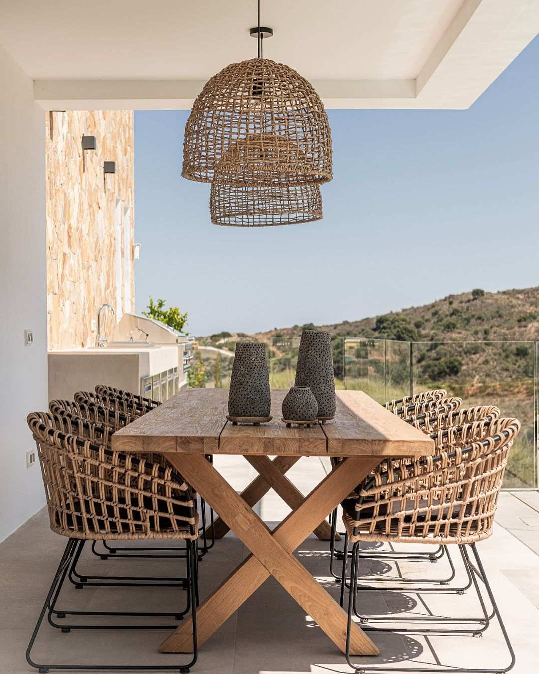 The dining set consists of a coffee table and some chairs. The materials used are wood, rattan, and iron.