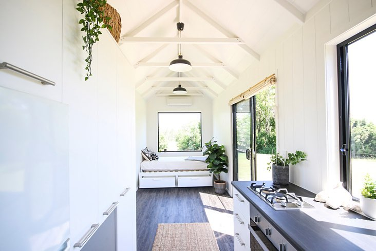 This house uses natural light for the main lighting during the day. There are some wide window glasses and a glass door. 