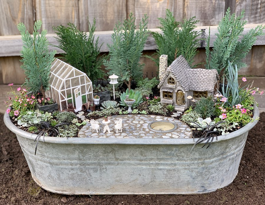Miniature fairy garden in vintage baby bath