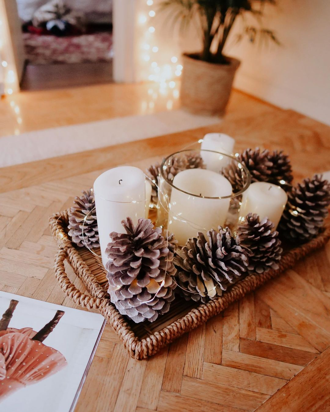 It is such an easy way to make this ornament. You just have to use a tray and then arrange the candles and pinecones.
