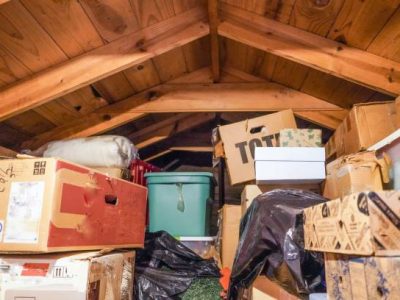 A disorganized attic. loft, or crawl-space above the residential garage.