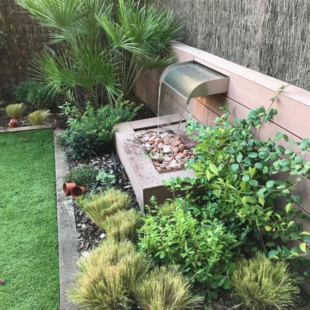 The wall fountain has gravel under it to make it look more natural.